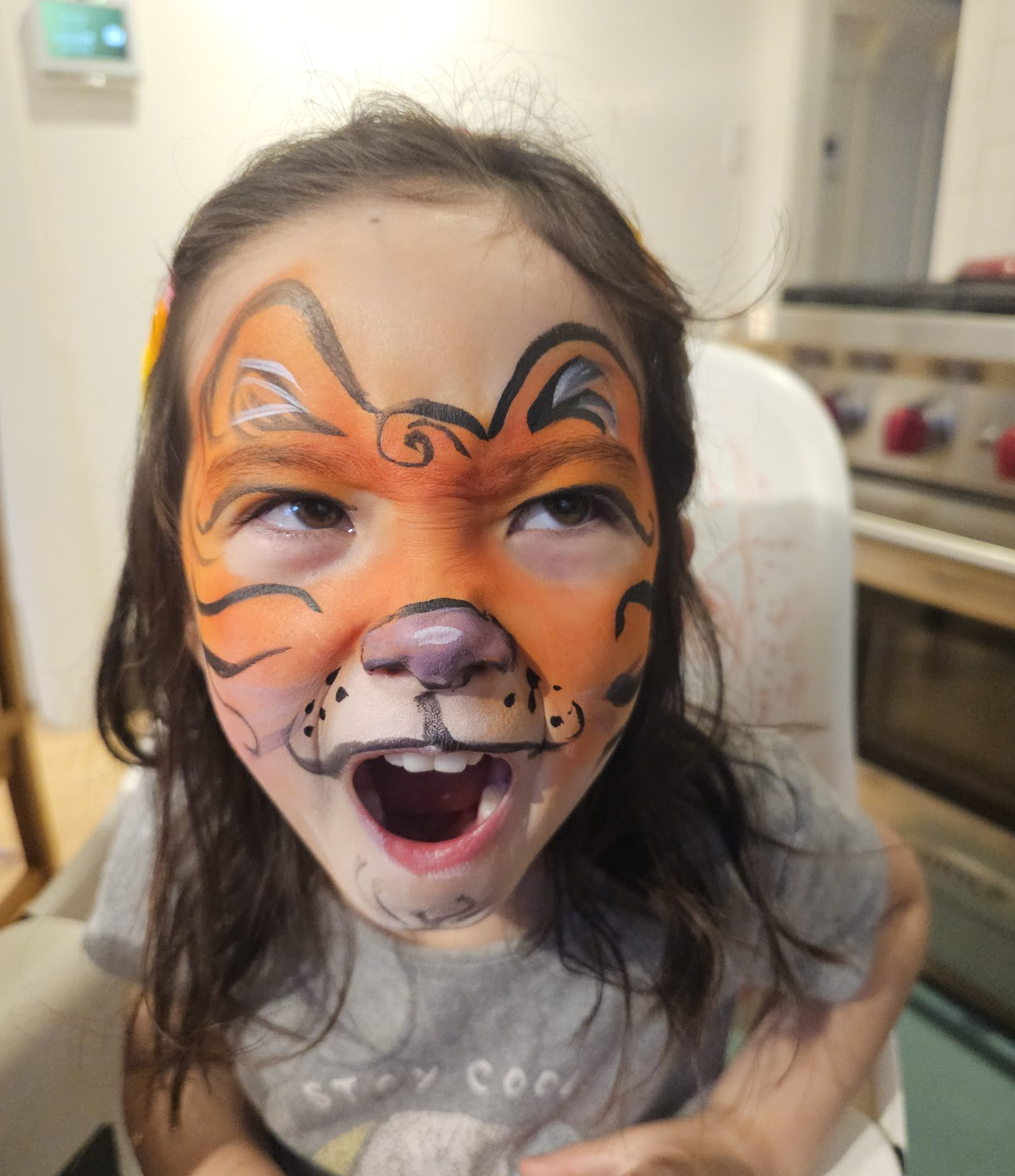 Child with tiger face painting