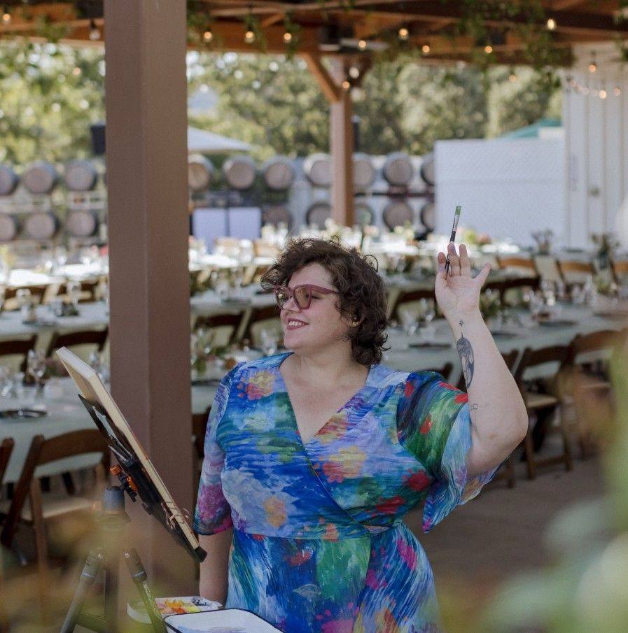 Live artist painting at a wedding reception